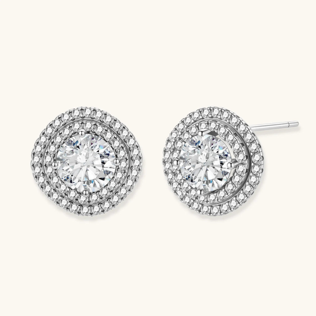 Double halo sterling silver stud earrings with brilliant round moissanite center stones and pavé crystal accents
