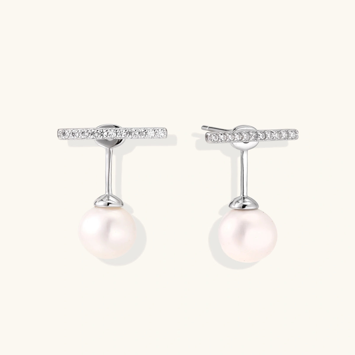 Rhodium-plated sterling silver ear jacket earrings with diamond-set horizontal bar and freshwater pearl drop