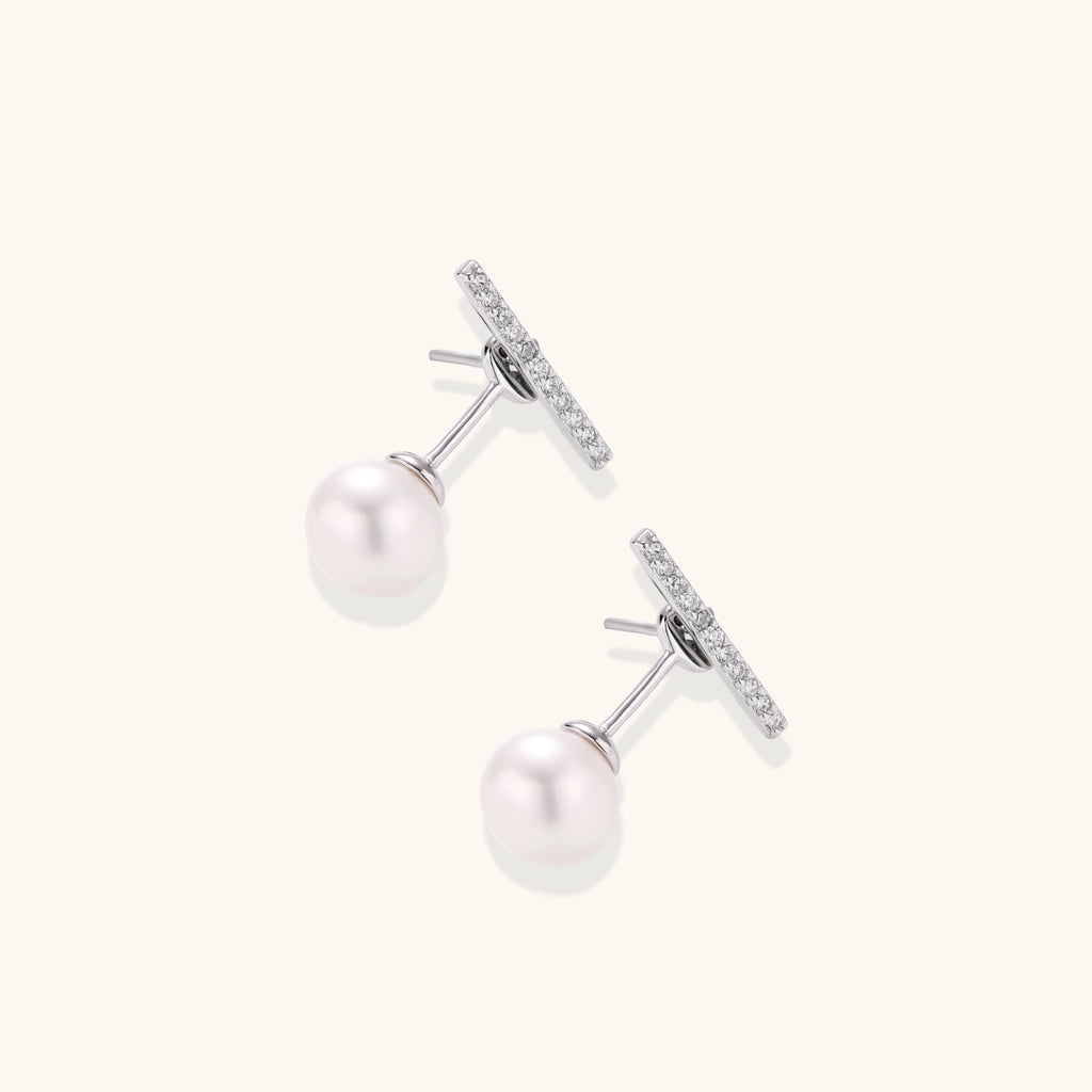 Rhodium-plated sterling silver ear jacket earrings with diamond-set horizontal bar and freshwater pearl drop