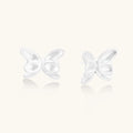 Pair of translucent butterfly-shaped stud earrings with frosted finish and dimensional wing details on white background