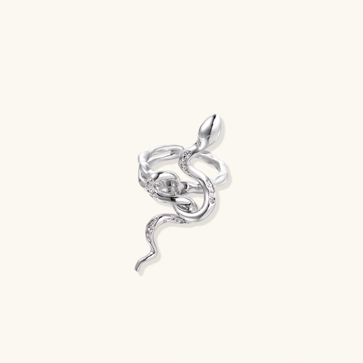 Sculptural white gold-plated snake ring with crystal accents coiling around finger in bold open design