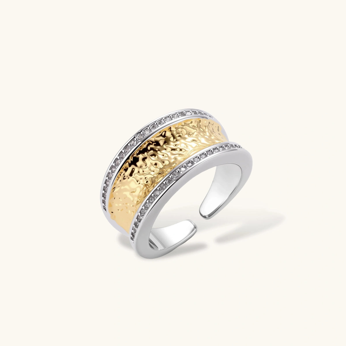 Wide two-tone ring with gold center band featuring intricate patterns and crystal accents on silver borders
