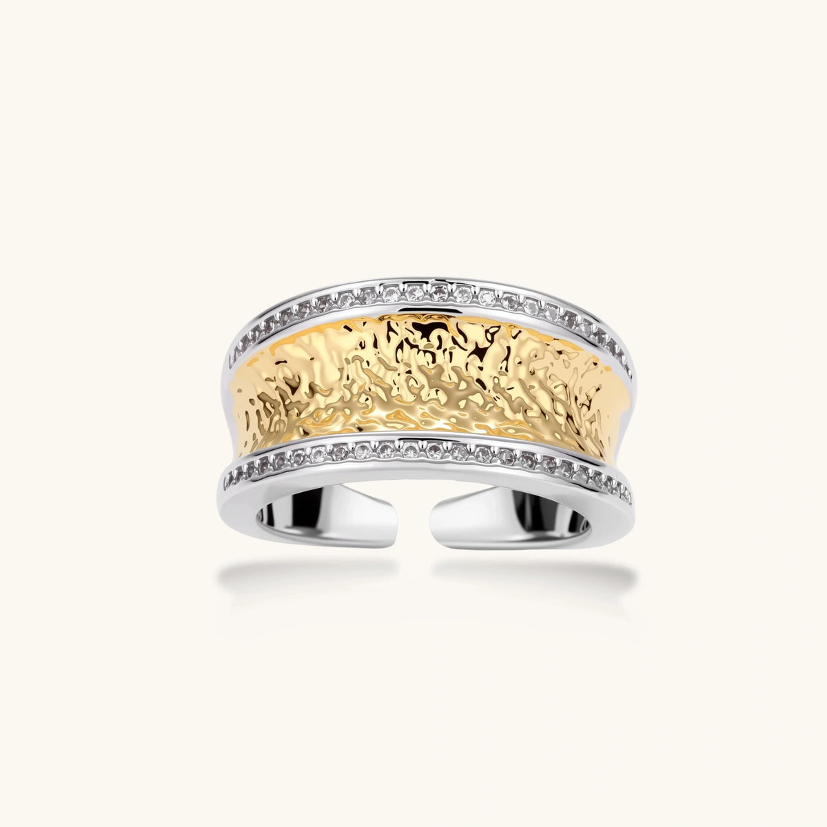 Wide two-tone ring with gold center band featuring intricate patterns and crystal accents on silver borders