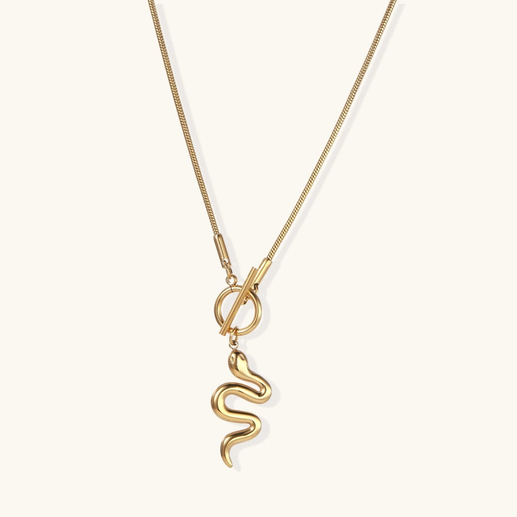 Simply Miss Meliss 14K gold plated stainless steel snake pendant necklace with a toggle clasp closure.